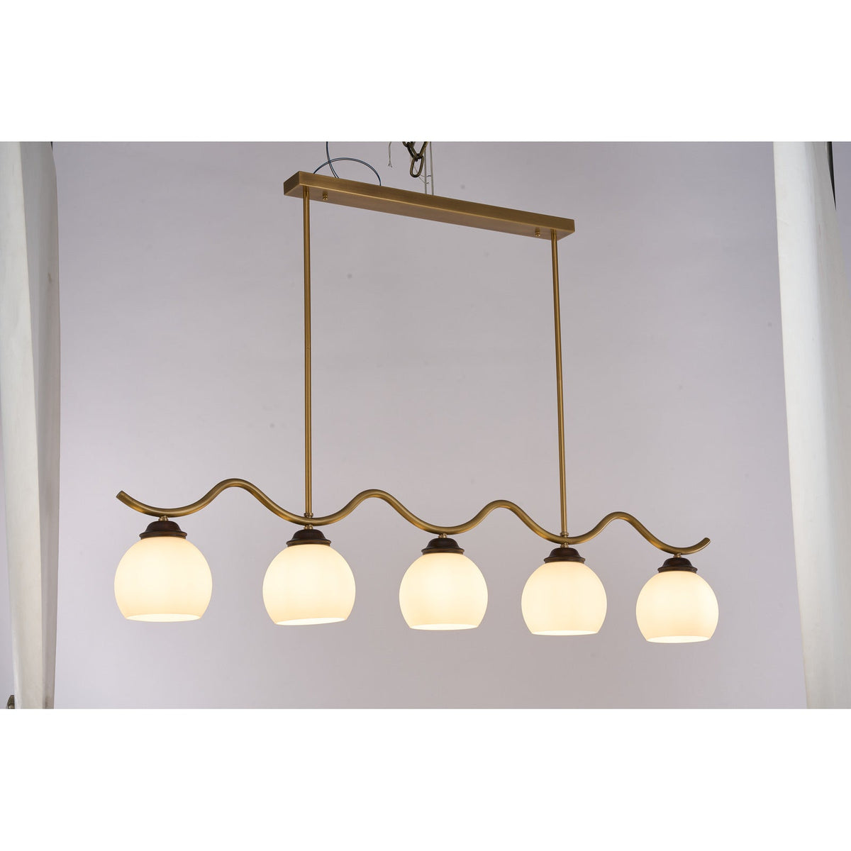 
Ondervale Opal Glass, Antique Brass and Ash Wood Linear Chandelier