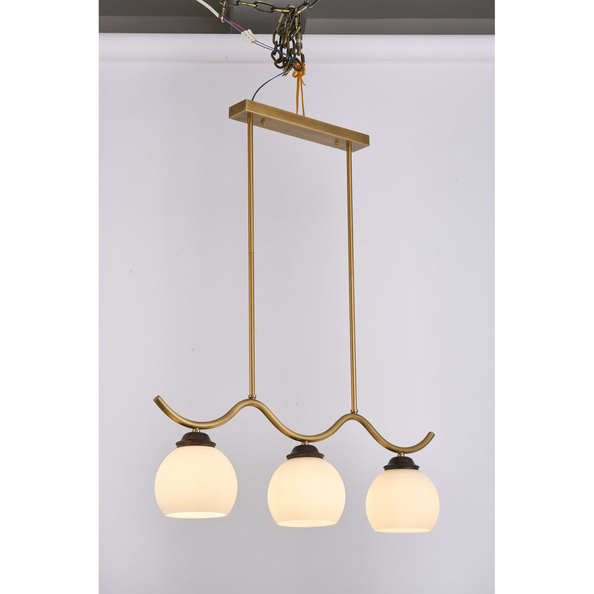 
Ondervale Opal Glass, Antique Brass and Ash Wood Linear Chandelier